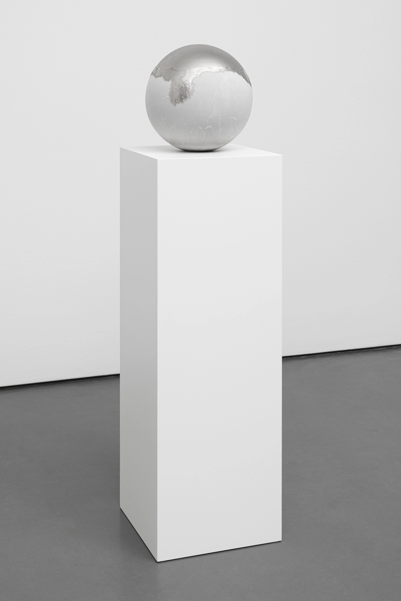 Frozen Sphere; sphere on pedestal with halfway melted frozen dew